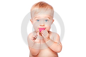 Cute baby with food spoon in mouth