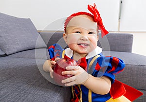 Cute baby girl with apple