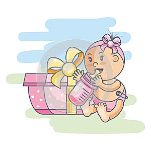 cute baby girl with bottle milk and gift box