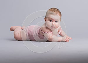 Cute baby girl crawling on the floor