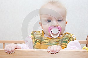 Cute baby girl with dummy