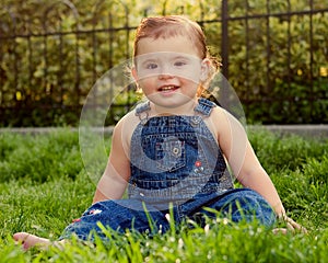 Cute baby girl on grass