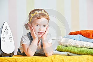 Cute baby girl housewife iron clothes iron, is engaged in domes