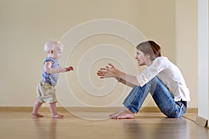 Cute baby girl learning to walk