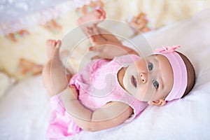 Cute baby girl in a pink dress