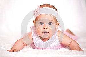 Cute baby girl in a pink dress