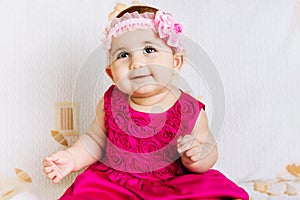 Cute baby girl in pink dress