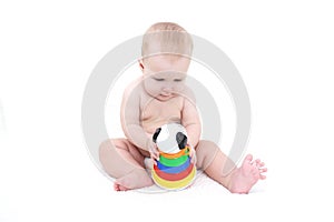 Cute baby girl plays toy
