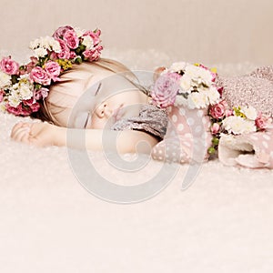 Cute baby girl sleep with flowers vintage