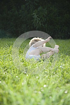 Cute Baby Girl Toppling On Grass