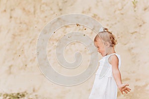 Cute baby girl walking and having fun outdoors. The concept of summer holiday. baby`s day. Family spending time together