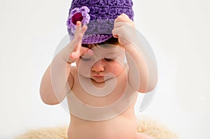 Cute baby girl wearing a hat