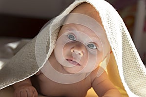 Cute baby girl in white towel