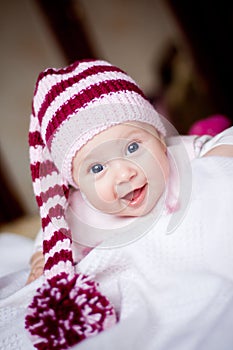 Cute baby in a hat with pompom