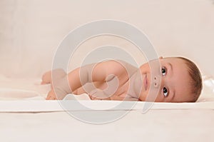 Cute baby look up lay down in the bed