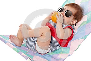 Cute baby lying on lounger