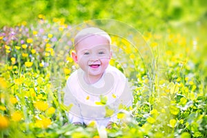 Cute baby n a blooming garden