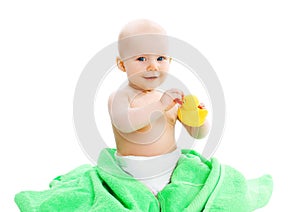Cute baby playing with yellow rubber duck