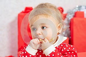 Cute baby portrait close-up. Child with a present gift. Holiday babies concept.