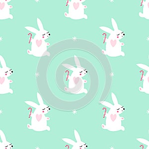 Cute baby rabbit jumping with candy cane and snowflakes seamless pattern on mint green background.
