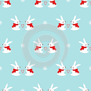 Cute baby rabbits with candy cane hearts and snowflakes seamless pattern on blue background.