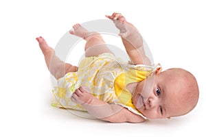 Cute baby rolling over isolated on white