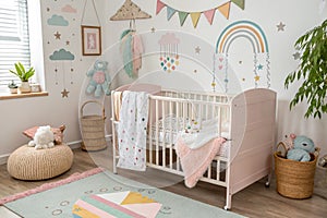 Cute baby room with crib and decor photo
