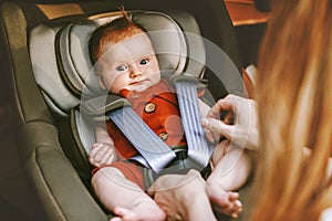 Cute baby in safety car seat family road trip vacations