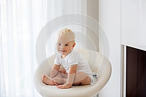 Cute baby sitting on a white background