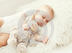 Cute baby sleeping on soft bed home