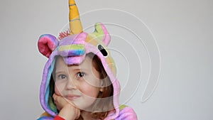 Cute baby smiling and playing. Portrait funny child in pajamas close up