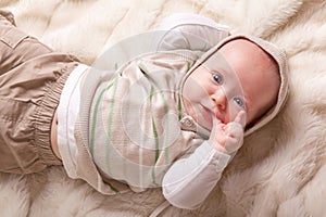 Cute baby sucking fingers