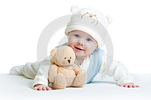 Cute baby weared funny hat with plush toy photo