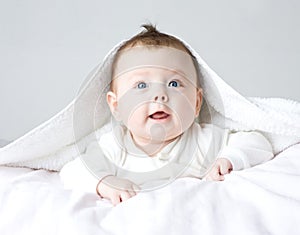 Cute baby in white clothing