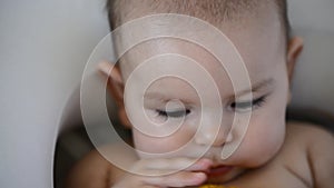 Cute baby with a yellow teething ring. Cute baby portrait