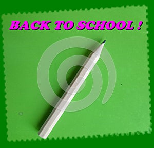 A cute `Back to school!` card with a little wooden pencil on a green paper sheet for notes!