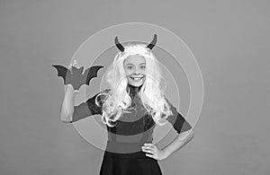 cute bat. child with small bat. teen girl wear long curly white hair wig for party celebration. autumn season holiday