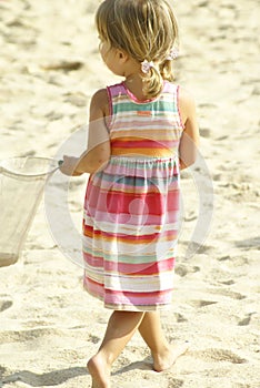 Cute beach girl walking