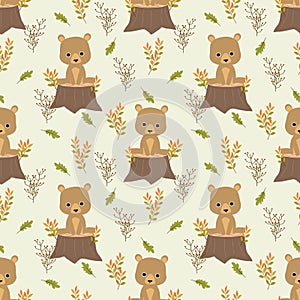 Cute bear is sitting on stump in autumn leaves background