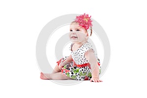 Cute beautiful baby girl in dot dress with butterflies and red w
