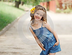 Cute beautiful girl with flower behind ear