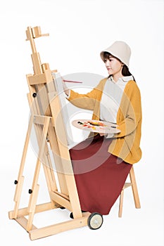 Cute beautiful girl painter