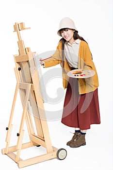 Cute beautiful girl painter