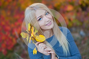 Cute beautifull girl lady woman with blond hair in stylish dress with hat standing in autumn forest.