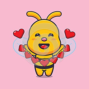 Cute bee cartoon character holding love decoration.