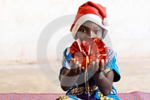 Cute Black African Christmas Girl Showing Present with Hands Happy and Joyful