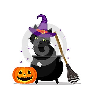 A cute black kitten in a purple witch hat sits in a cauldron next to a witch`s broom