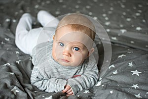 Cute blond baby with blue eye