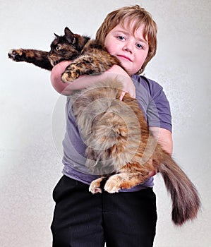 Cute blond boy with a cat