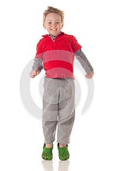 Cute blond boy jumping